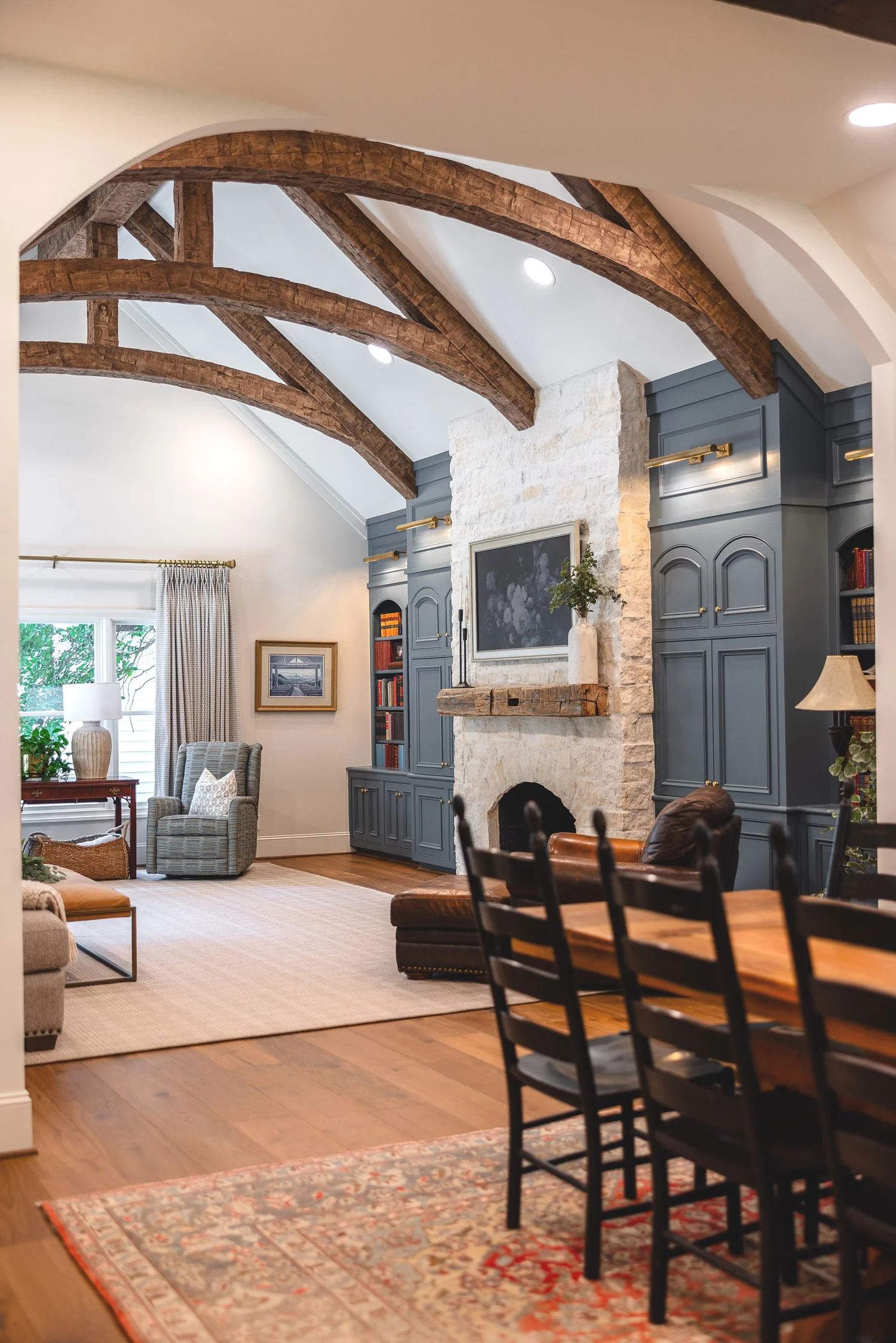 Living room with stone fireplace and custom built-ins